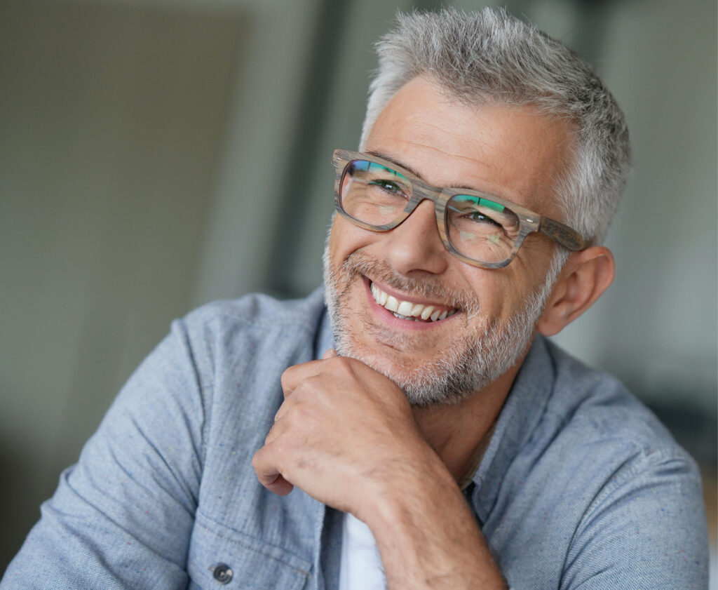 Smiling elderly man with glasses